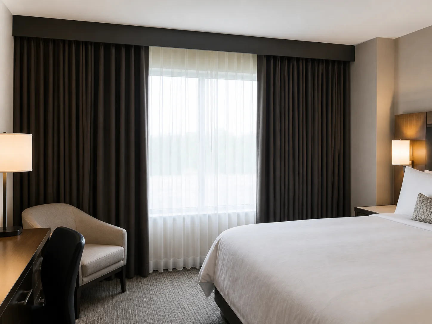 Hotel room with tailored blackout drapery and no visible light leaks