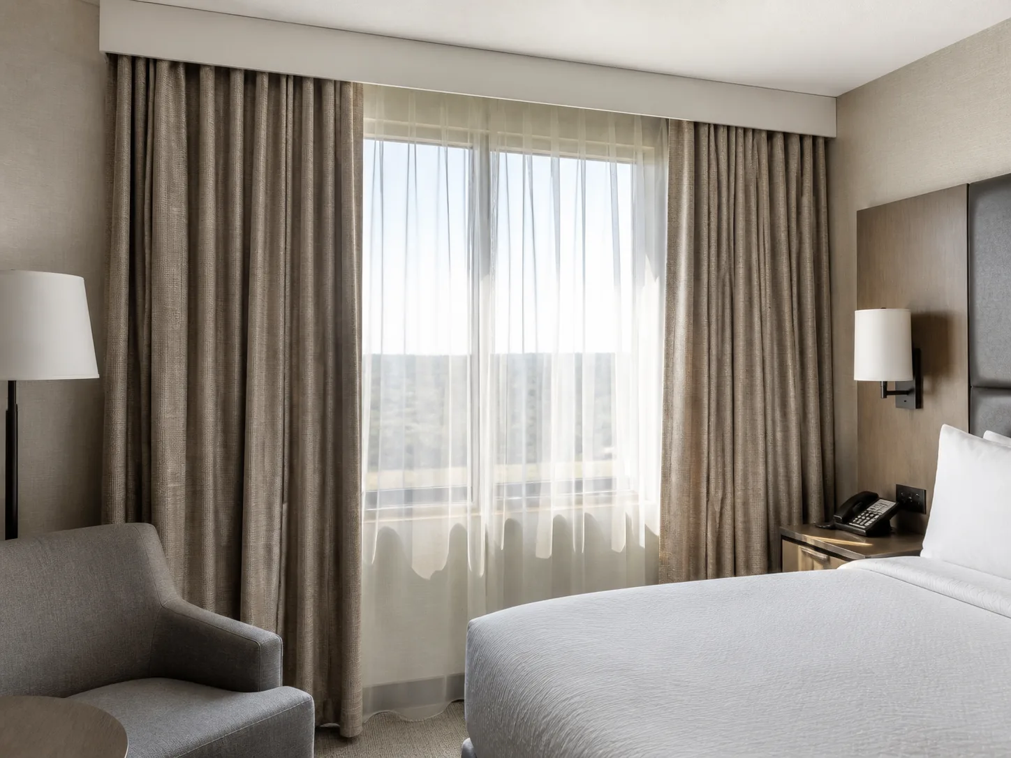 Fresh commercial hotel drapery fabric in a clean guest room