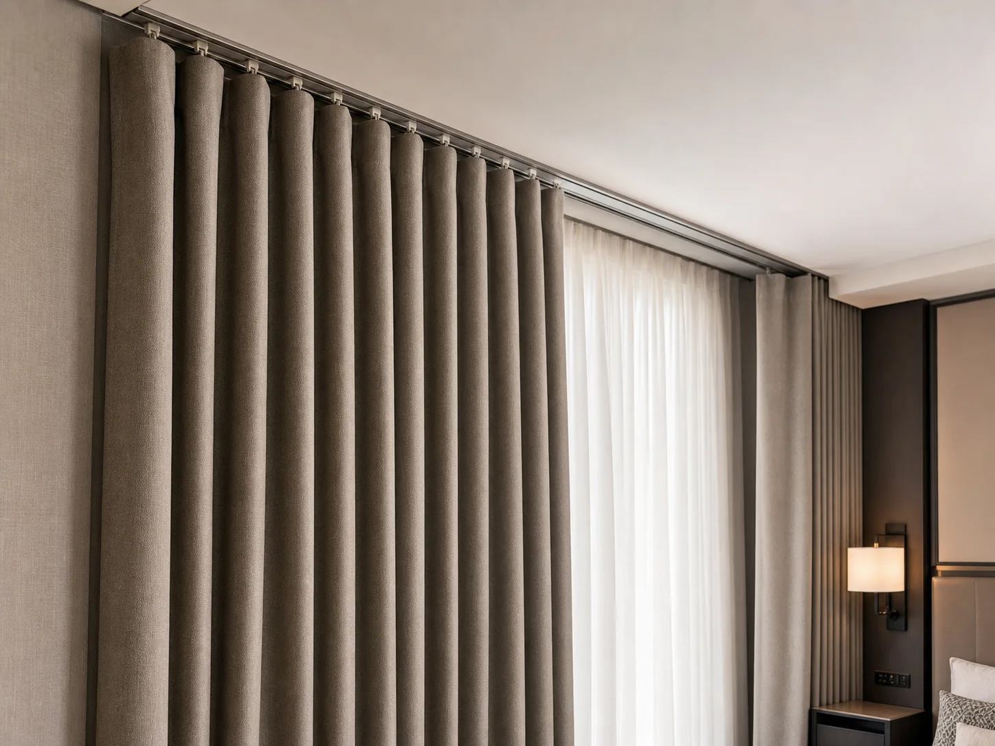 Premium hotel drapes with aligned commercial track hardware